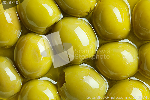 Image of green olives in olive oil