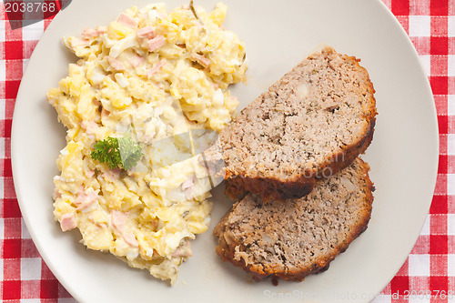 Image of baked meatloaf with potato salad
