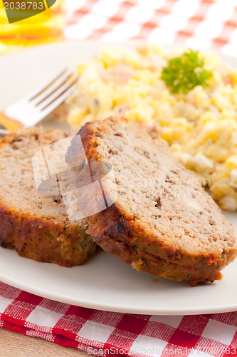 Image of baked meatloaf with potato salad