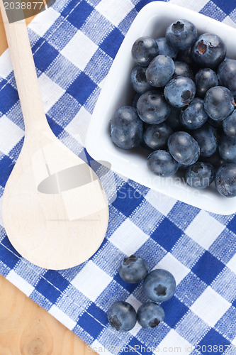 Image of blueberries on checkered tablecloth