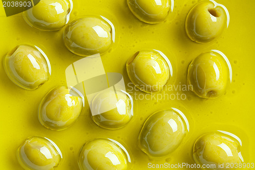 Image of green olives in olive oil