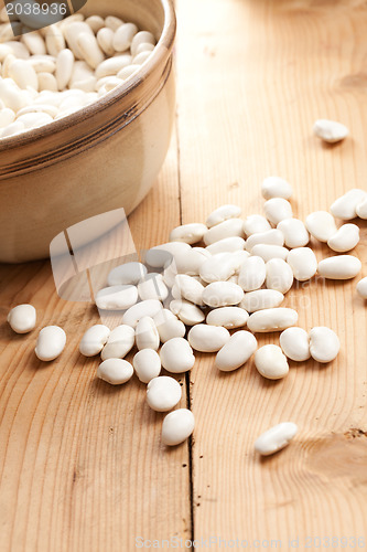 Image of white beans on wooden table