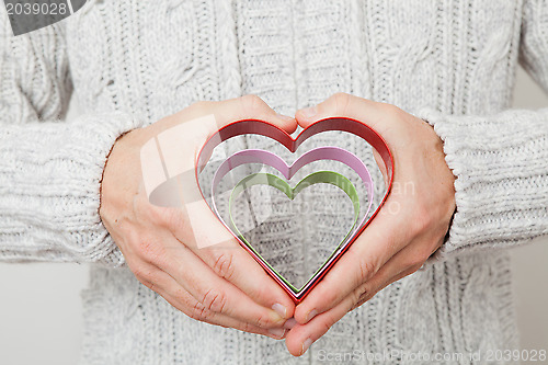 Image of Heart symbols held in hands