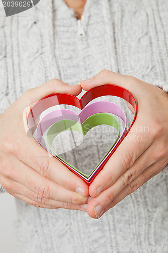 Image of Heart symbols held in hands