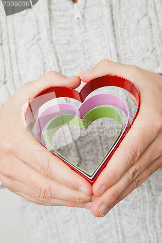 Image of Heart symbols held in hands