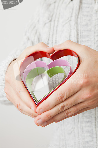 Image of Heart symbols held in hands