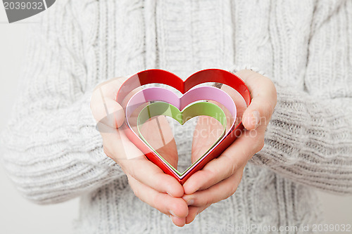 Image of Heart symbols held in hands