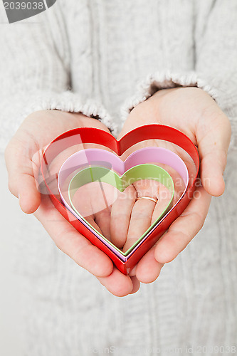 Image of Heart symbols held in hands