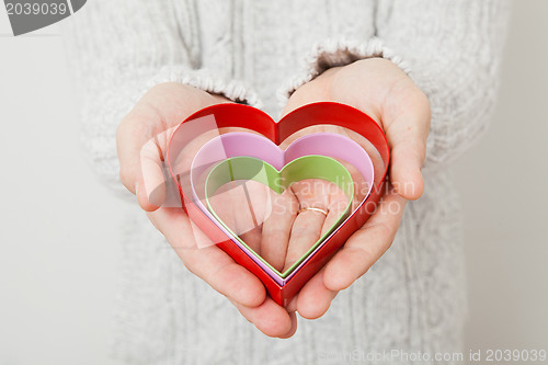 Image of Heart symbols held in hands