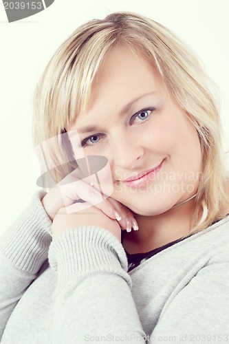 Image of cute smiling relaxing plump woman