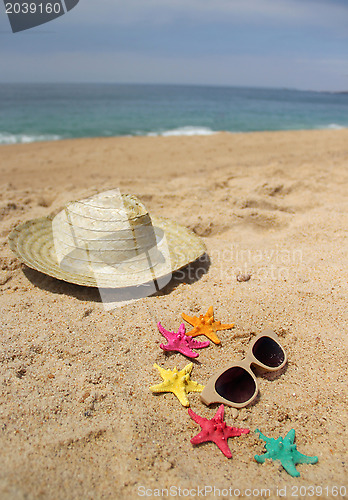 Image of  Beach items, sand and starfishes 