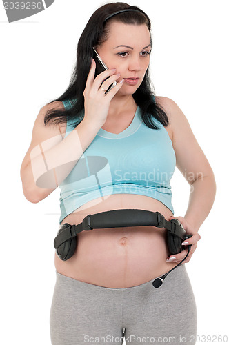 Image of Pregnant with headphones