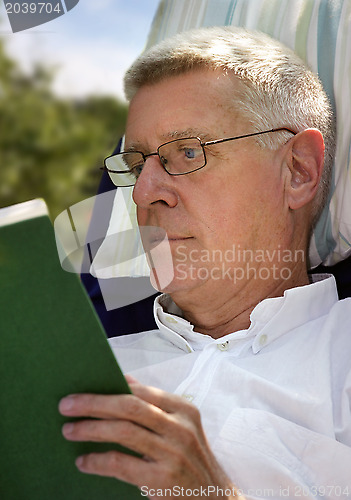 Image of Senior Man reading book