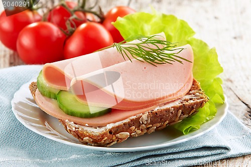 Image of sandwich with sausage slices