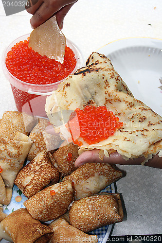Image of Russian pancakes with caviar of fish - national tradition