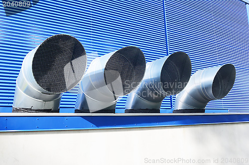 Image of four ventilation pipes of industrial building