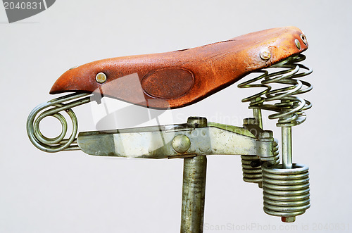 Image of old-fashioned vintage leather bike saddle