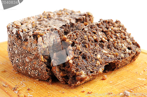 Image of sliced homemade brown bread on cutting board