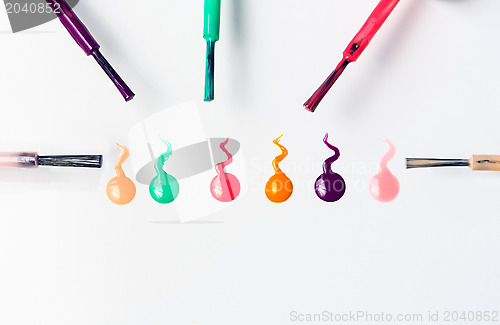 Image of brush strokes and colorful nail polish