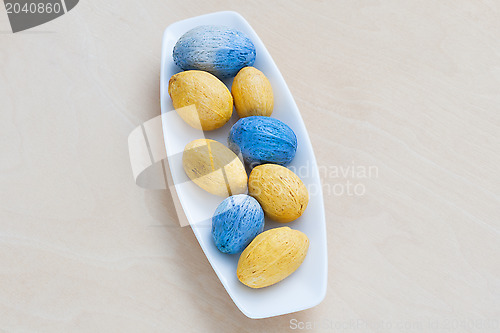 Image of colorful decorative nuts on a plate