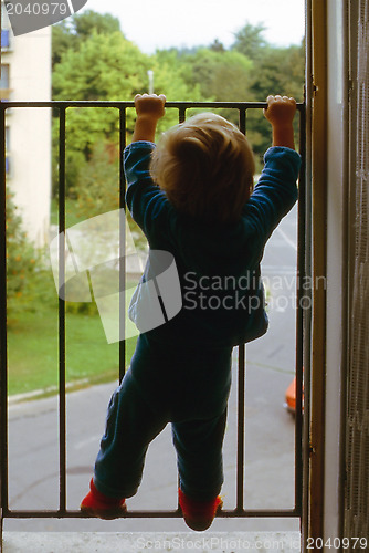 Image of Little boy in window