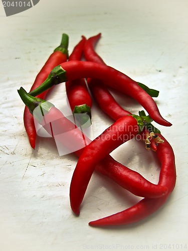 Image of red ripe and burning decorative pepper