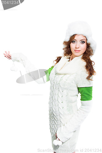 Image of beautiful girl with winter fur cap on isolated white