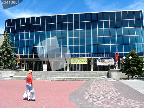 Image of modern building and a girl near it