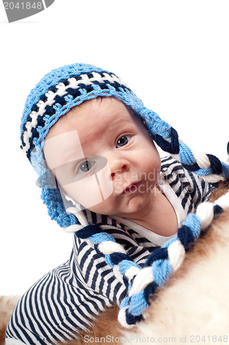 Image of Newborn baby in blue hat