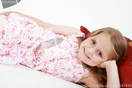 Image of Cute playful little girl relaxing