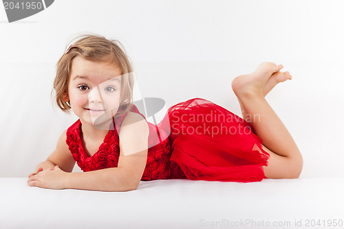 Image of Cute playful little girl relaxing