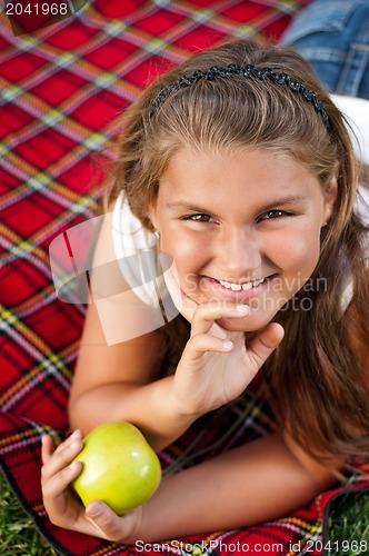 Image of Little girl with apple
