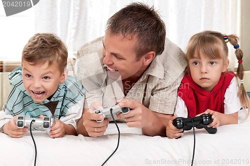 Image of Happy family playing a video game