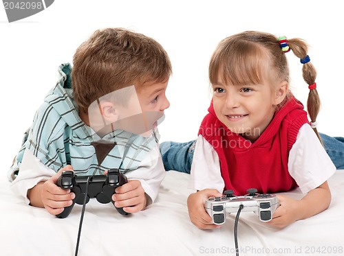 Image of Happy girl and boy playing a video game