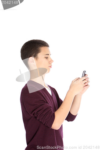 Image of Teenage boy texting on his mobile