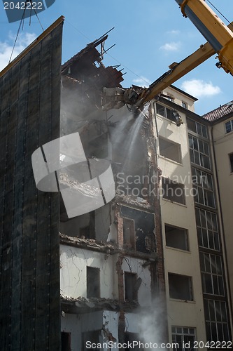 Image of Demolition cranes dismantling a building