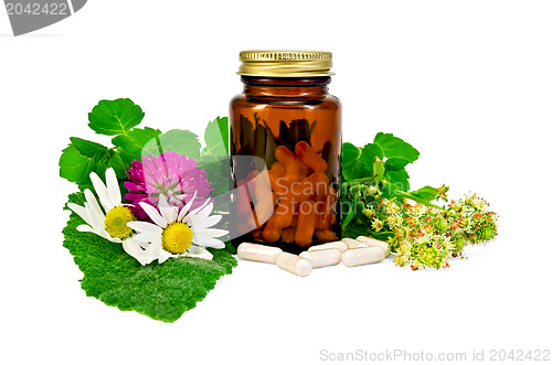 Image of Capsules in a brown sealed jars with herbs
