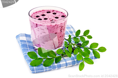 Image of Milkshake with blueberries on a blue napkin