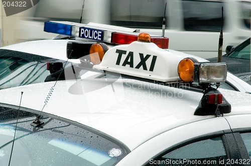 Image of taxi & police detail