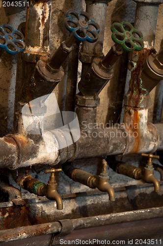 Image of Old rusty pipes and valves