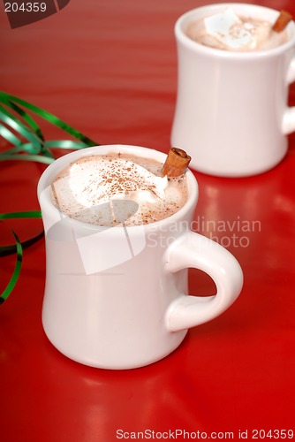 Image of Two cups of hot chocolate with green ribbon