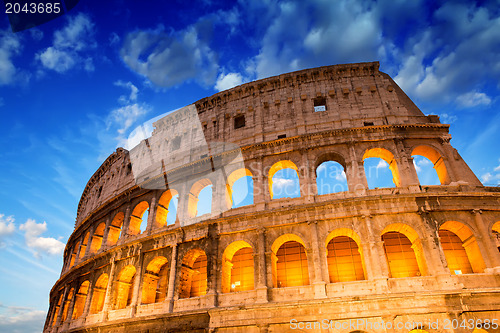 Image of Beautiful dramatic sky over Colosseum in Rome