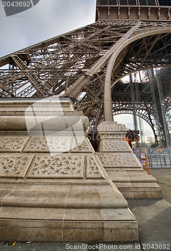 Image of Eiffel Tower Pylon and bottom, street level view