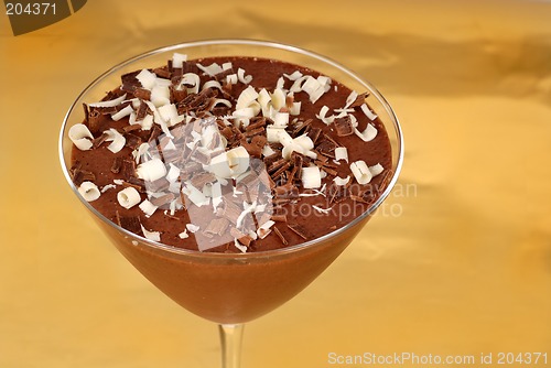 Image of Chocolate pudding with chocolate curls in a martini glass
