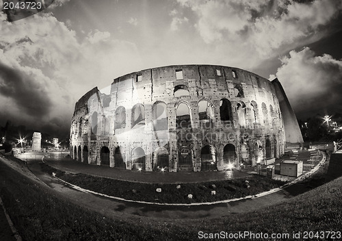 Image of Dramatic sky above Colosseum in Rome. Night view of Flavian Amph