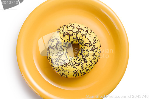 Image of sweet doughnut on yellow plate