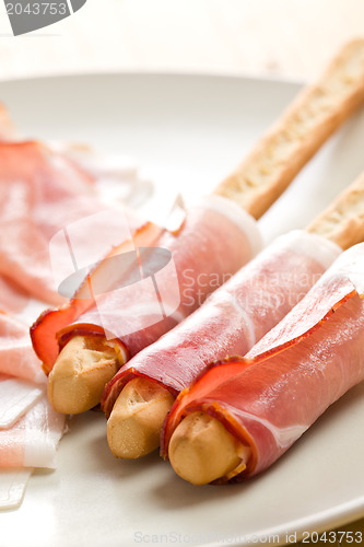 Image of grissini sticks with ham