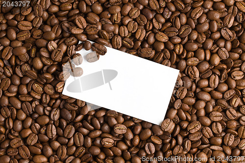 Image of white card on coffee beans background