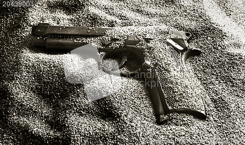 Image of Pistol in sand