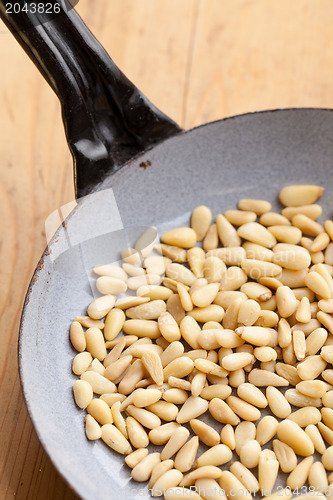 Image of roasted pine nuts on pan